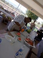 Bishop J. Norfleet preparing watermelon